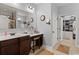 Bright bathroom with double sinks, vanity, and access to a walk-in closet at 129 Astoria Park Loop, Conway, SC 29526
