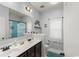 Well-lit bathroom featuring a double vanity, large mirror, and neutral color scheme at 129 Astoria Park Loop, Conway, SC 29526
