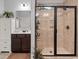 Tiled bathroom featuring a glass door shower, vanity, and updated fixtures at 129 Astoria Park Loop, Conway, SC 29526