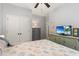 Bright bedroom with a ceiling fan, neutral walls, and coordinated bedding and furnishings at 129 Astoria Park Loop, Conway, SC 29526