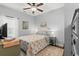 Calm bedroom with ceiling fan, neutral walls, wood floors, and coordinated bedding at 129 Astoria Park Loop, Conway, SC 29526