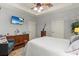 Spacious primary bedroom with hardwood floors, TV, and ample closet space at 129 Astoria Park Loop, Conway, SC 29526