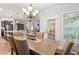 Dining area with chandelier lighting adjacent to the kitchen and doorway at 129 Astoria Park Loop, Conway, SC 29526