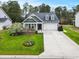 Inviting single-story home boasting well-maintained landscaping and a convenient two-car garage at 129 Astoria Park Loop, Conway, SC 29526