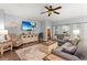 Comfortable living room featuring cozy seating, a ceiling fan, and a decorative media center at 129 Astoria Park Loop, Conway, SC 29526
