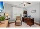 Comfortable home office features a ceiling fan, neutral walls, and a large wooden desk at 129 Astoria Park Loop, Conway, SC 29526