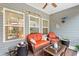 Cozy screened porch featuring comfortable seating and decor, providing a relaxing outdoor space at 129 Astoria Park Loop, Conway, SC 29526