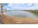 Panoramic aerial view of a sandy lake beach with tall trees at 1525 Capella Ln., Myrtle Beach, SC 29575