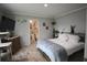 Bedroom featuring a cozy bed, a TV, wooden dresser, and an en-suite bathroom at 1525 Capella Ln., Myrtle Beach, SC 29575
