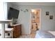 Cozy bedroom featuring a TV, wooden dresser, and an en-suite bathroom at 1525 Capella Ln., Myrtle Beach, SC 29575