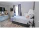 Bedroom featuring a comfy bed, side table, and a round mirror on the wall at 1525 Capella Ln., Myrtle Beach, SC 29575