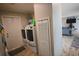 Well-equipped laundry room with a washer, dryer, and ample storage space at 1525 Capella Ln., Myrtle Beach, SC 29575