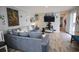 Spacious living room featuring an open layout and a large, comfortable couch, perfect for relaxing at 1525 Capella Ln., Myrtle Beach, SC 29575