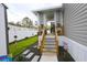 Inviting patio area with decorative touches and a staircase, perfect for relaxing and enjoying the outdoor space at 1525 Capella Ln., Myrtle Beach, SC 29575