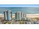Aerial view of oceanfront buildings, beach, and cityscape at 201 S Ocean Blvd. # 1812, Myrtle Beach, SC 29577