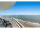 Relax on the balcony and enjoy the stunning ocean views from this coastal condo with comfortable seating at 201 S Ocean Blvd. # 1812, Myrtle Beach, SC 29577