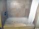 Bathroom features a tiled shower and tub with jacuzzi jets at 201 S Ocean Blvd. # 1812, Myrtle Beach, SC 29577