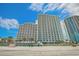Oceanfront condo building with balconies, set on a sandy beach at 201 S Ocean Blvd. # 1812, Myrtle Beach, SC 29577