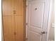 Hallway with light wood storage and a white door at 201 S Ocean Blvd. # 1812, Myrtle Beach, SC 29577