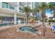 Resort-style hot tub next to building, features lounge chairs and ' play area at 201 S Ocean Blvd. # 1812, Myrtle Beach, SC 29577