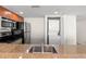 Clean kitchen with stainless steel appliances and convenient washer/dryer combo at 201 S Ocean Blvd. # 1812, Myrtle Beach, SC 29577