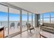 Relax in this stylish condo living room with ocean views from large windows and comfortable seating for a serene experience at 201 S Ocean Blvd. # 1812, Myrtle Beach, SC 29577