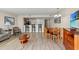 Cozy living room with wood floors, bar seating, and a dining area at 201 S Ocean Blvd. # 1812, Myrtle Beach, SC 29577
