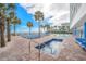 Large pool deck with ocean views, lounge chairs, and palm trees at 201 S Ocean Blvd. # 1812, Myrtle Beach, SC 29577