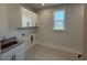 The laundry room features granite counters, modern cabinets and a window for natural light at 242 River Edge Dr., Myrtle Beach, SC 29588