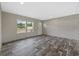 Inviting living room with neutral walls, wood-look floors, and windows that fill the space with natural light at 2711 W Highway 9 Bypass, Loris, SC 29569
