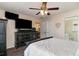 Spacious bedroom featuring a ceiling fan, television, and ensuite bathroom access at 550 Crusade Circle, Conway, SC 29526