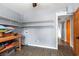 Unfinished basement area with shelves for storage and wood-look flooring at 67 Kingsbury Pl., Georgetown, SC 29440