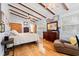 Comfortable bedroom boasts hard wood floors, exposed beams, and lots of natural light at 67 Kingsbury Pl., Georgetown, SC 29440