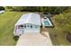 Aerial view of a beautiful two-story home with a backyard pool and well-maintained grounds at 67 Kingsbury Pl., Georgetown, SC 29440