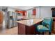 Open kitchen with stainless steel appliances, granite countertops, and breakfast bar seating at 67 Kingsbury Pl., Georgetown, SC 29440