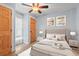 Cozy bedroom featuring a tufted headboard bed and classic ceiling fan at 67 Kingsbury Pl., Georgetown, SC 29440