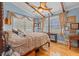 Serene main bedroom featuring a four-poster bed, hardwood floors, and ceiling fan at 67 Kingsbury Pl., Georgetown, SC 29440