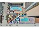 Aerial view of an outdoor pool area, lazy river, bar, and ocean view for a complete vacation at 9550 Shore Dr. # 1026, Myrtle Beach, SC 29572