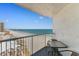 Balcony showcasing ocean and pier view, complete with table and chairs to admire the landscape at 9550 Shore Dr. # 1026, Myrtle Beach, SC 29572