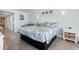 Spacious beach themed bedroom featuring tile floors, a queen bed, and a nightstand at 9550 Shore Dr. # 1026, Myrtle Beach, SC 29572