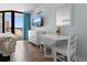 Bright bedroom with a tiled floor, beach themed decor, and sliding glass doors to the balcony at 9550 Shore Dr. # 1026, Myrtle Beach, SC 29572