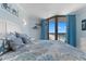 Bedroom featuring a queen bed, balcony access, and tasteful beach decor at 9550 Shore Dr. # 1026, Myrtle Beach, SC 29572