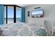 Bedroom featuring a queen bed, balcony access, and tasteful beach decor at 9550 Shore Dr. # 1026, Myrtle Beach, SC 29572