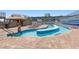 Pool area with a lazy river, lounge chairs, and umbrellas for a relaxing day at 9550 Shore Dr. # 1026, Myrtle Beach, SC 29572