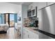 Cozy living space featuring a kitchenette and bedroom area with balcony overlooking the ocean at 9550 Shore Dr. # 1026, Myrtle Beach, SC 29572