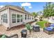 The backyard patio features brick flooring and outdoor seating with a gas fire pit, perfect for entertaining or relaxing at 1000 Oak Marsh Ln., North Myrtle Beach, SC 29582