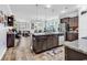 Open layout showcasing the kitchen with a center island and stainless appliances with an eat in kitchen and living area at 1000 Oak Marsh Ln., North Myrtle Beach, SC 29582