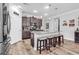 Beautiful kitchen with granite countertops, dark wood cabinets, stainless steel appliances, and a large island with seating at 1000 Oak Marsh Ln., North Myrtle Beach, SC 29582