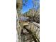 Stairs lead down to a serene lake surrounded by trees, visible from the home's window at 1030 Waccamaw Lake Dr., Conway, SC 29526
