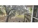 View of a shaded backyard from the deck, highlighting the peaceful surroundings at 1030 Waccamaw Lake Dr., Conway, SC 29526